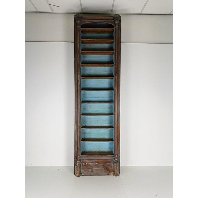 This large antique bookcase from the United Kingdom, showcasing a beautiful, aged patina that enhances their timeless...