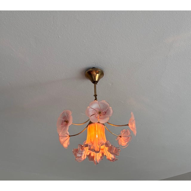 A magnificent piece of authentic Italian glassmaking, this vintage Murano pendant light features a striking central...