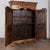 18th century French two door wedding armoire, crafted in pine with a rich brown patina. Elaborate carving is seen...