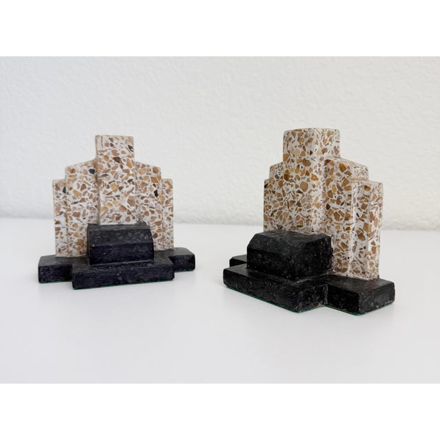 A rare pair of vintage Art Deco Italian bookends made of two-tone terrazzo stone composite. Features a geometric design...