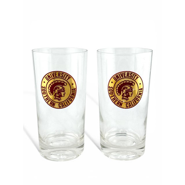 Rare set of 4 highball glasses featuring the classic 60’s USC logo in 22k gold and red details. Some minor wearing to two...