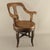 An Austrian swivel barber or hairdresser armchair from the early 20th century, crafted from solid walnut. The chair...