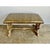 Midcentury silvered "X" style benches newly upholstered in faux embossed ostrich style gold washed leather. The benches...