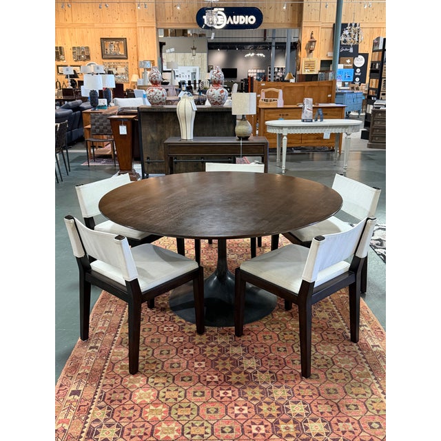 Designed by Barlas Baylar for Restoration Hardware, this set of five Saddle Dining Chairs draws inspiration from the...