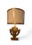 A striking one-of-a-kind table lamp custom-created from an intricately carved giltwood architectural fragment. The...