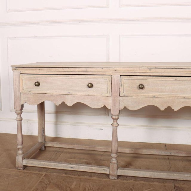 Long 18th Century English bleached oak 3 drawer dresser base 1760 This piece is designed in the style of the selected...