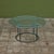 Patio coffee table in patinated bronze designed by Walter Lamb and produced by Brown Jordan. The frame is described by two...