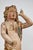 An iconic, hand carved, gessoed, painted, and parcel-gilt, Italian polychrome sculpture of tousle curled angel in...