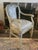 A wonderfully decorative vintage Louis XVI Revival armchair combining elegant Neoclassical form with distinctive Wedgwood-...