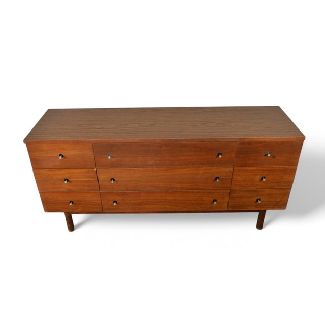 Origin: USA Designer: Unknown Manufacturer: Stanley Furniture Era: 1960s Materials: Walnut, Laminate (Top) Measurements:...