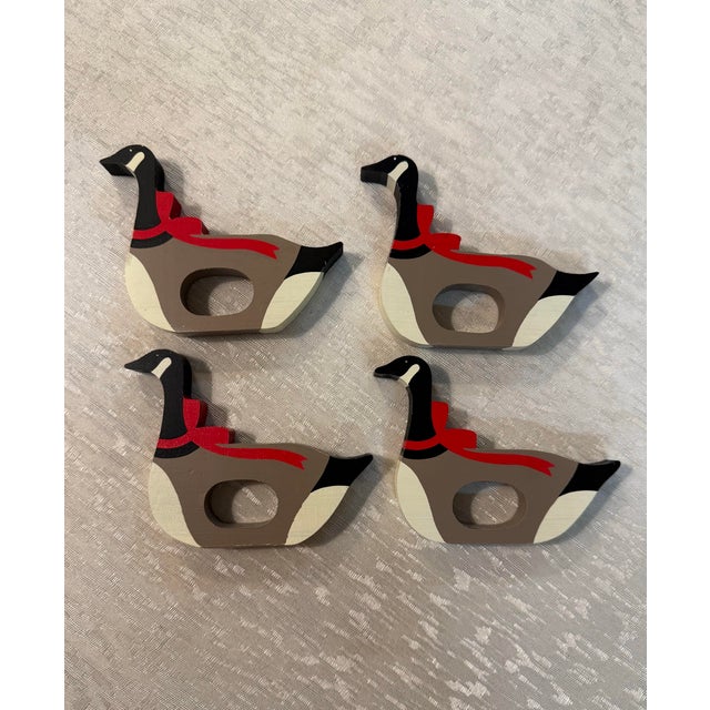 Vintage set of four painted wood Christmas goose napkin rings. Made by the Hallmark company in the 1980's. Add this silly...