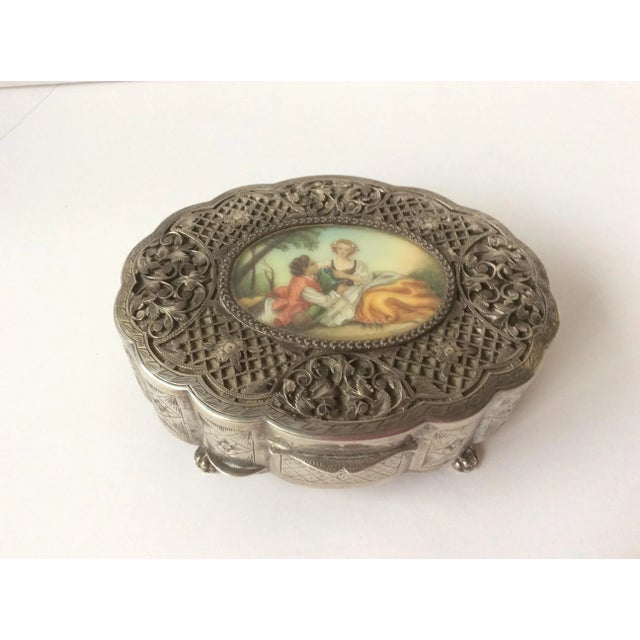 Beautiful antique 800 silver box with fine details and paw feet, interior lined in red velvet and miniature romantic...