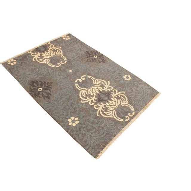 This elegant hand knotted rug features a modern fusion of beauty, with its interlocking geometric and minimalist pattern....