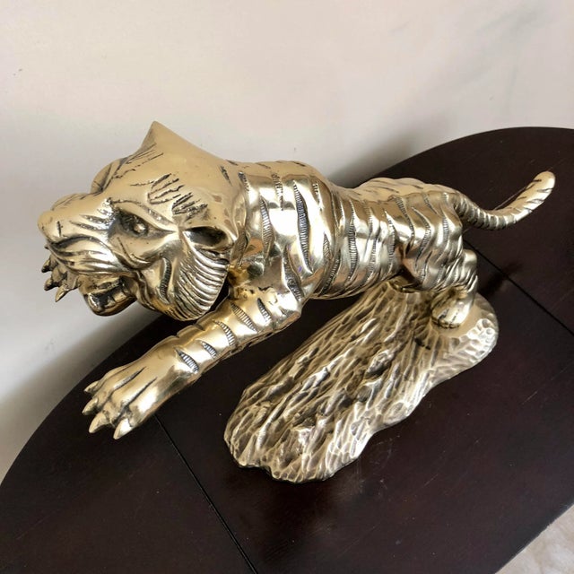 Vintage polished brass leaping tiger statue. Quality construction, quite heavy.