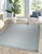 Timeless Celia Gray Flatweave Wool Rug, Country of Origin: India. This sophisticated piece exemplifies the high quality...