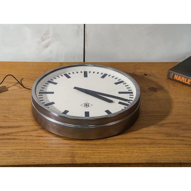 An original Telenorma secondary clock, once one of dozens of identical dials wired into a single synchronized timekeeping...