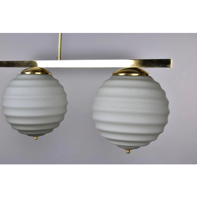 2010s New Italian Fixture With 4 Pale Taupe Globes on Horizontal Brass Bar For Sale - Image 5 of 12