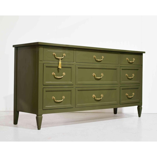Bold, glamorous, and beautifully crafted, this mid-century Hollywood Regency dresser by Mount Airy makes a striking...