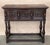 This large Spanish late 19th century features a beautiful one plank rectangular top over a carved drawer featuring...
