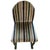 Charming vintage striped accent chair, sourced from a Nashville estate, featuring a rounded upholstered back and...