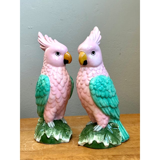 This delightful pair of vintage porcelain parrot figurines brings color, charm, and refined craftsmanship to any interior....