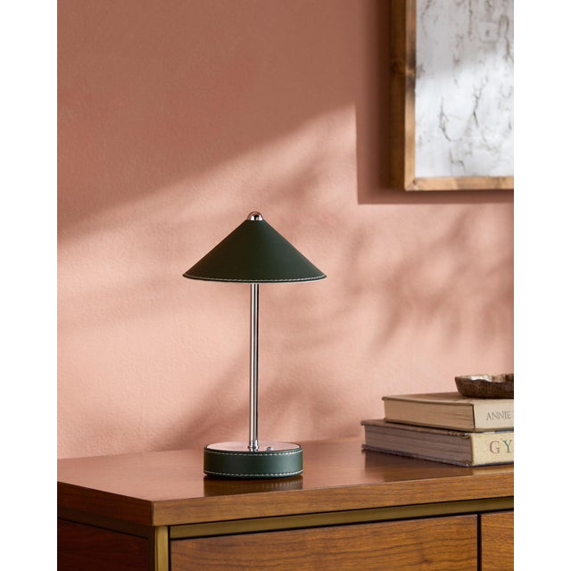 Illuminate your space with a touch of mid-century modern flair, courtesy of the Nomelle accent table lamp. Standing at an...