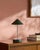 Illuminate your space with a touch of mid-century modern flair, courtesy of the Nomelle accent table lamp. Standing at an...