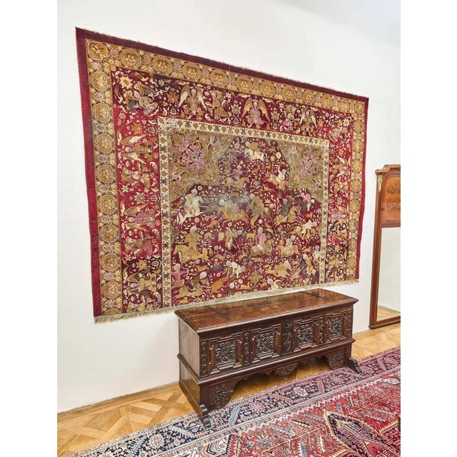 Fragment of a rug from the second half of the 18th century. rug from Middle East with a hunting motif and a rich border...