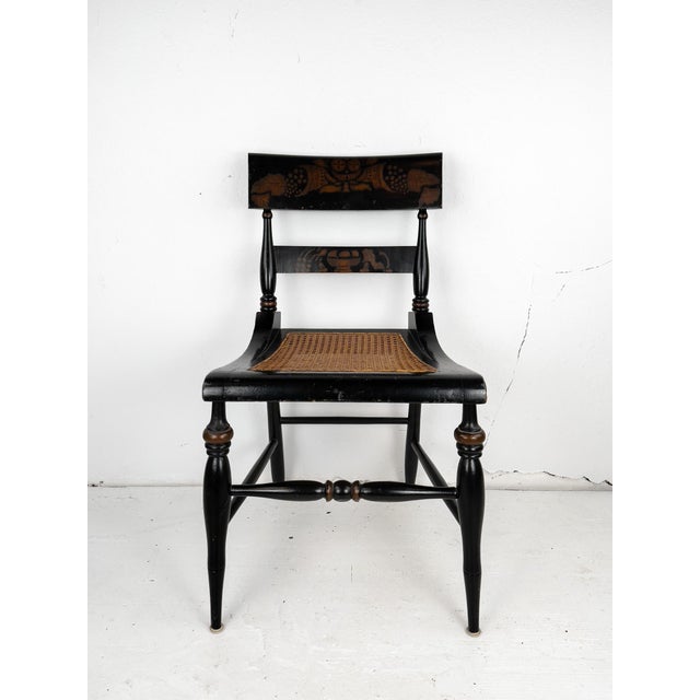 An attractive Hitchcock-style side chair with beautiful stenciling and a cane seat. “The concept for mass producing...