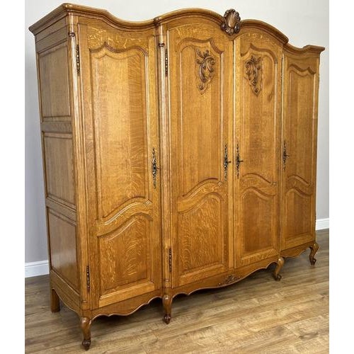 A beautifully proportioned Vintage French Louis wardrobe , full of charm and elegance with its flowing curves and refined...
