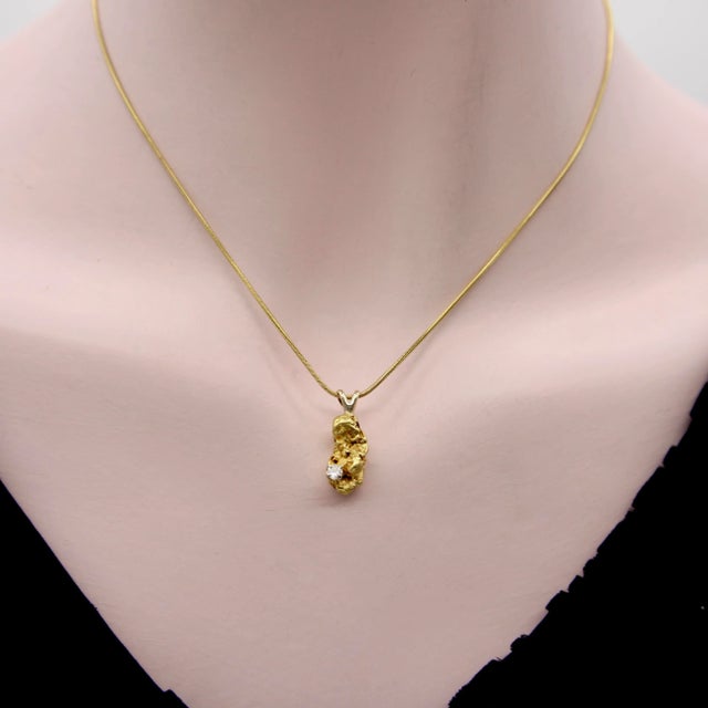 This is part of Chairish’s Fine Jewelry assortment. This beautiful charm features a single 22k gold nugget hung from an...