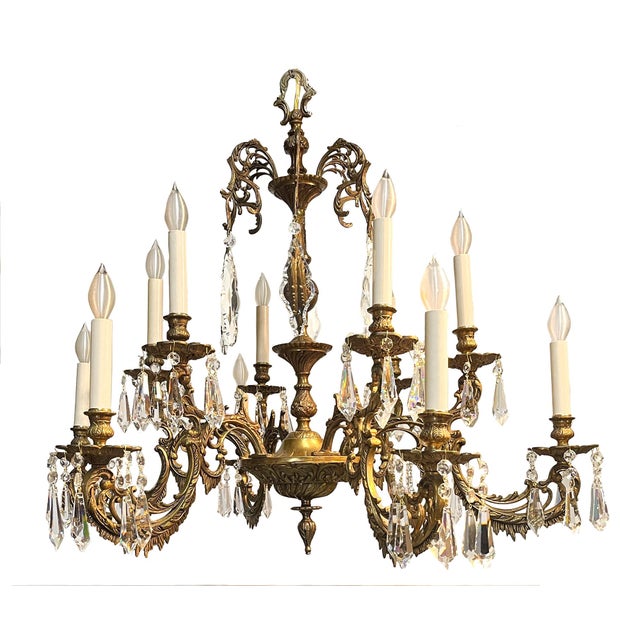Made in Spain, this handsome, solid brass chandelier makes a powerful design statement, a beautiful balance of elegance...