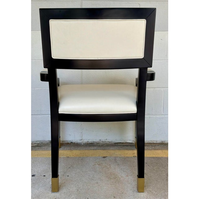 Original retail $6480, stylish Currey & Company Modern Black and Gold Greek Key Chairs Pair, cram leather upholstery,...