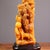 This is a highly detailed and intricately carved stone sculpture depicting a mythical dragon amidst a stylized cloud or...