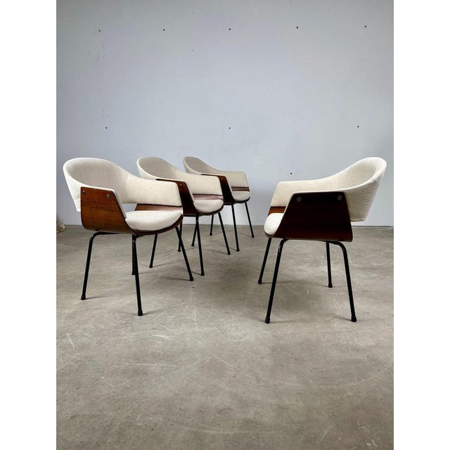 An elegant set of 4 chairs in authentic 1950s style, featuring a timeless design that fits perfectly into classic,...