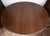 An oval Napoleon III table made of solid walnut, dating from the second half of the 19th century. The oval tabletop rests...