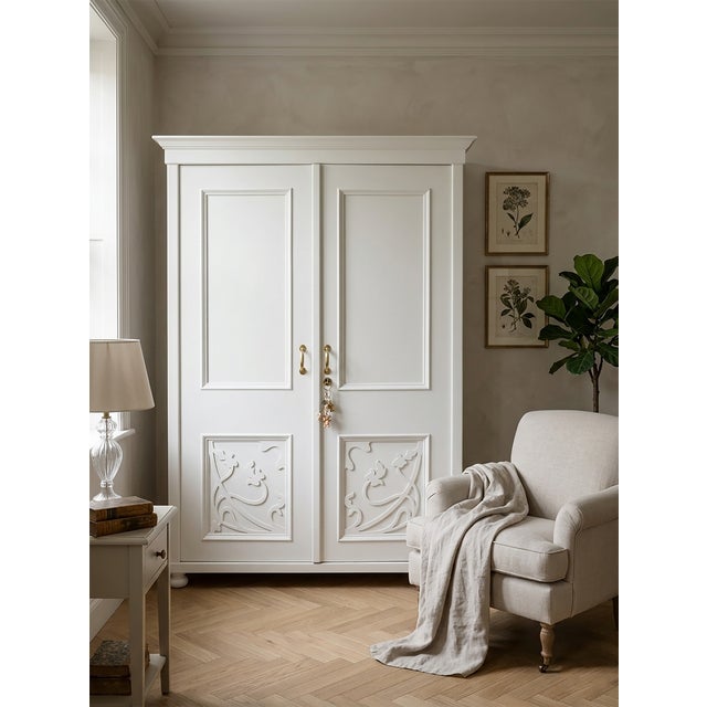 This beautifully restored two-door wardrobe blends classic elegance with a serene, minimalist white finish. The piece has...