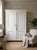 This beautifully restored two-door wardrobe blends classic elegance with a serene, minimalist white finish. The piece has...