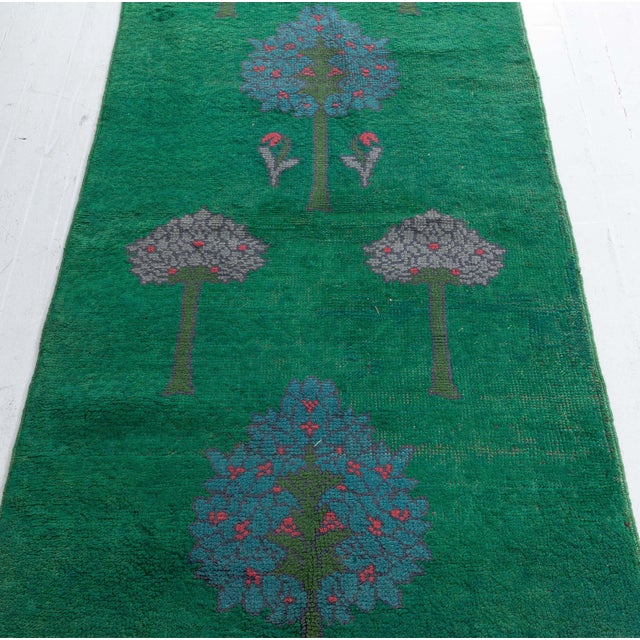 Antique Arts and Crafts Runner by CF Voysey Size: 3'0" × 13'4" (91 × 406 cm) A rare and remarkable Donegal by C.F.A....