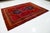 Vintage Hand-knotted Persian Shiraz Wool rug. This rug has a red field and navy blue accents in an over-tribal motif. this...