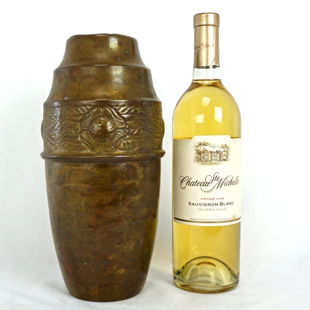 A stylized Art Nouveau /early Art Deco copper vase with a tin liner to hold flower. The copper urn shaped vase has a...