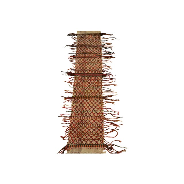 This vintage 2x8 tribal Kilim is a unique mid-century curation, and an ideal table runner given its narrow size. Handwoven...