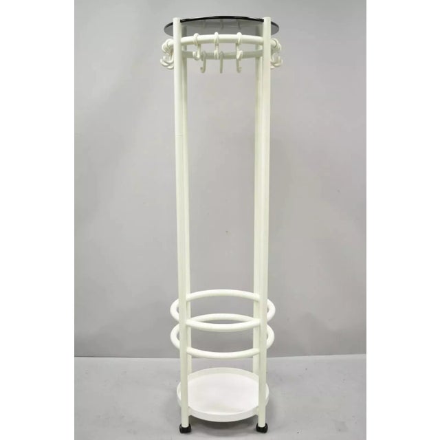 Vintage Mid Century Modern Joe Colombo Style Coat Tree Stand. Item features a white coated plastic frame, 12 hooks, lower...