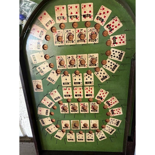 Lindstroms Poker Pin Ball Game The marbles are shot up into the board and where the balls land is how you get your poker...