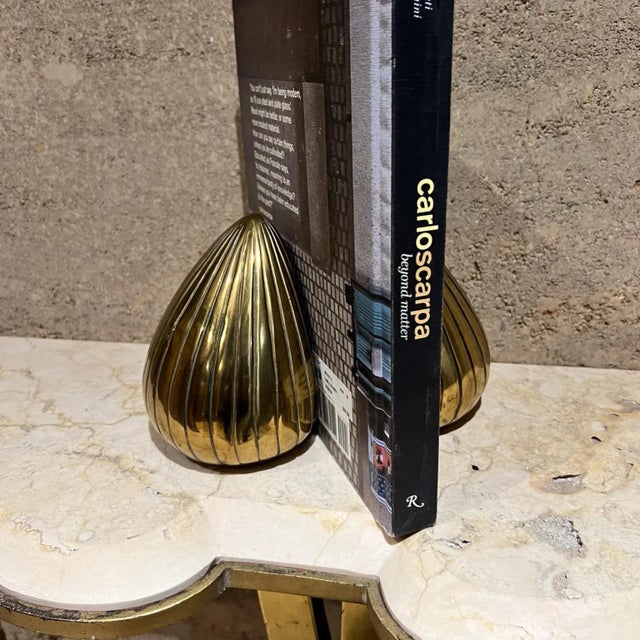 For your consideration, iconic sculptural bookends are commonly referred to as "Clamshell", "Teardrop", or "Onion" pieces....