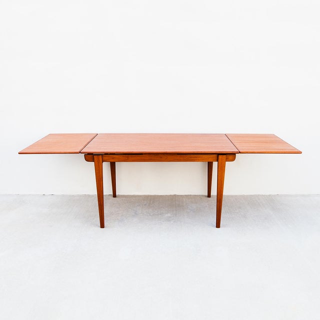 Exceptional mid century modern teak draw leaf dining table from Denmark. The table expands from 55 to 98 inches,...
