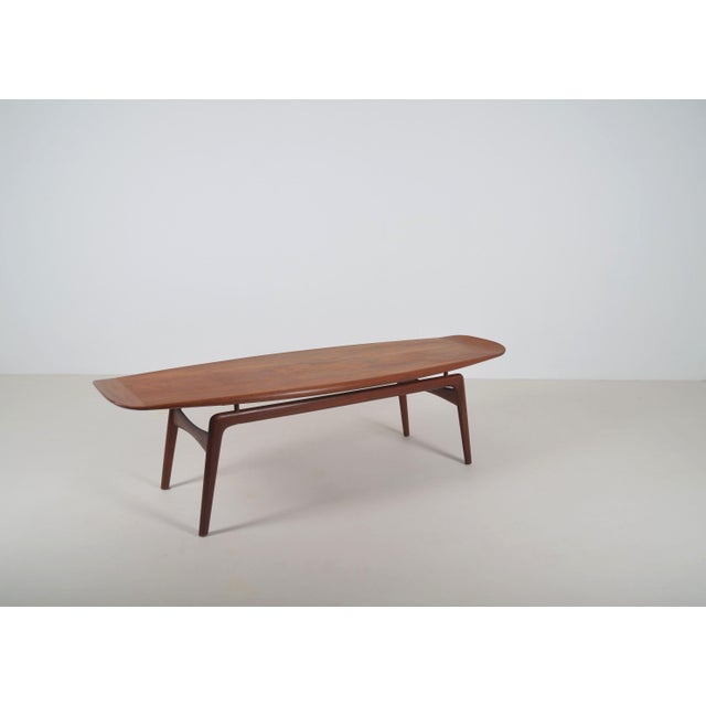 Danish Surfboard coffee table designed by Arne Hovmand Olsen in the 1950s. This beautifully shaped table in high-quality...