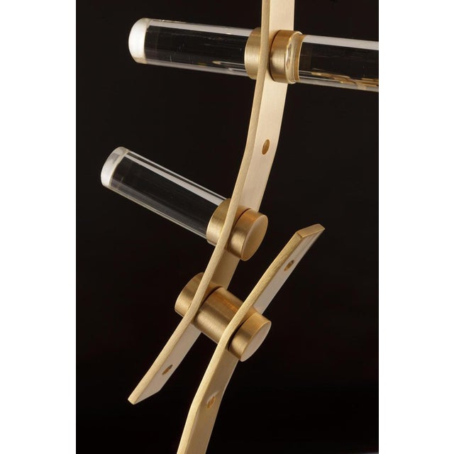 This set of six contemporary brass and glass wall sconces by baroncelli, produced in italy as part of the flexus fosco...