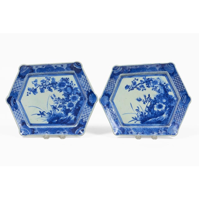An outstanding pair of Japanese cobalt blue and white porcelain Imari faceted hexagonal-shaped platters of the Meiji...