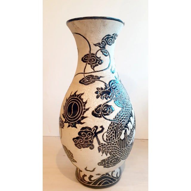 Chinese porcelain Fahua dragon vase. A sky dragon chases a large Yin/Yang pearl of wisdom amid incised clouds, flames and...